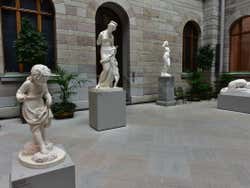 A courtyard with 4 sculptures in it
